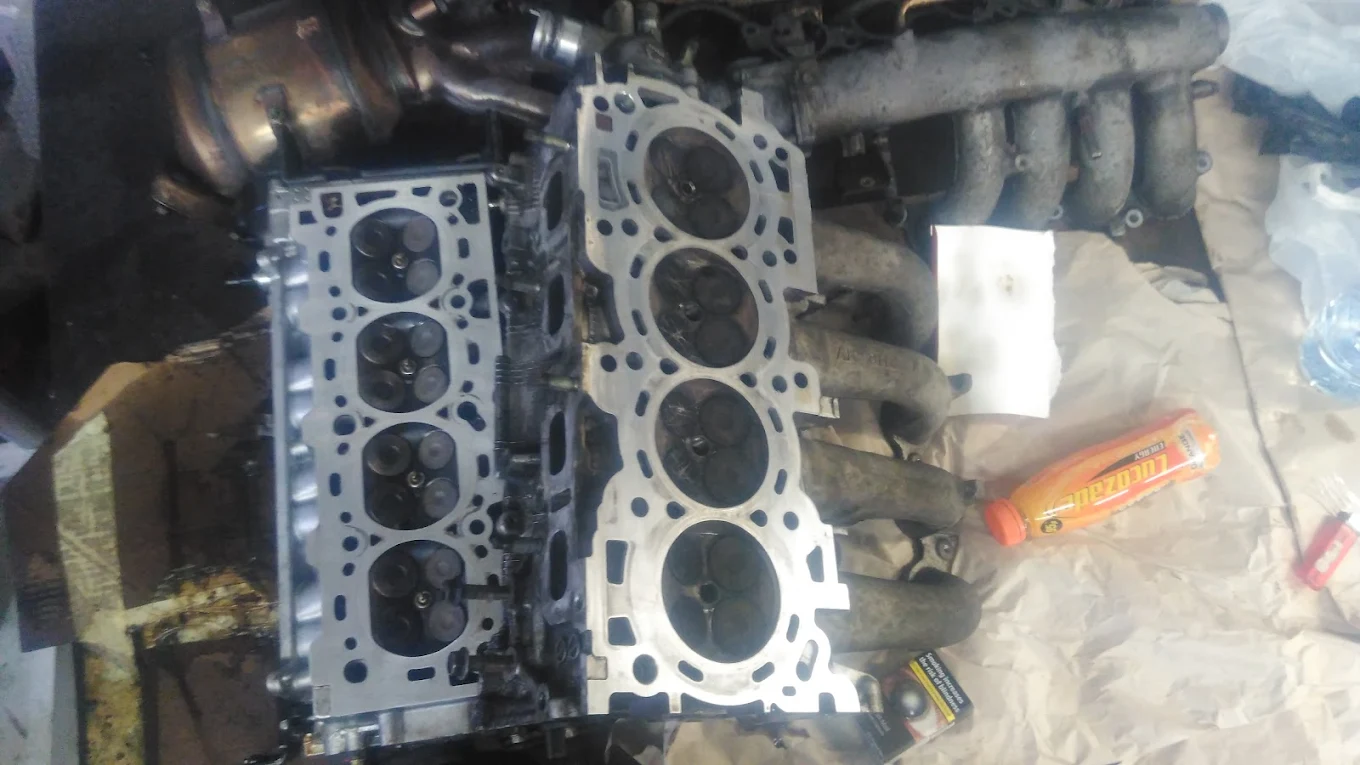 Cylinder head and manifold off the engine during an in-depth repair
