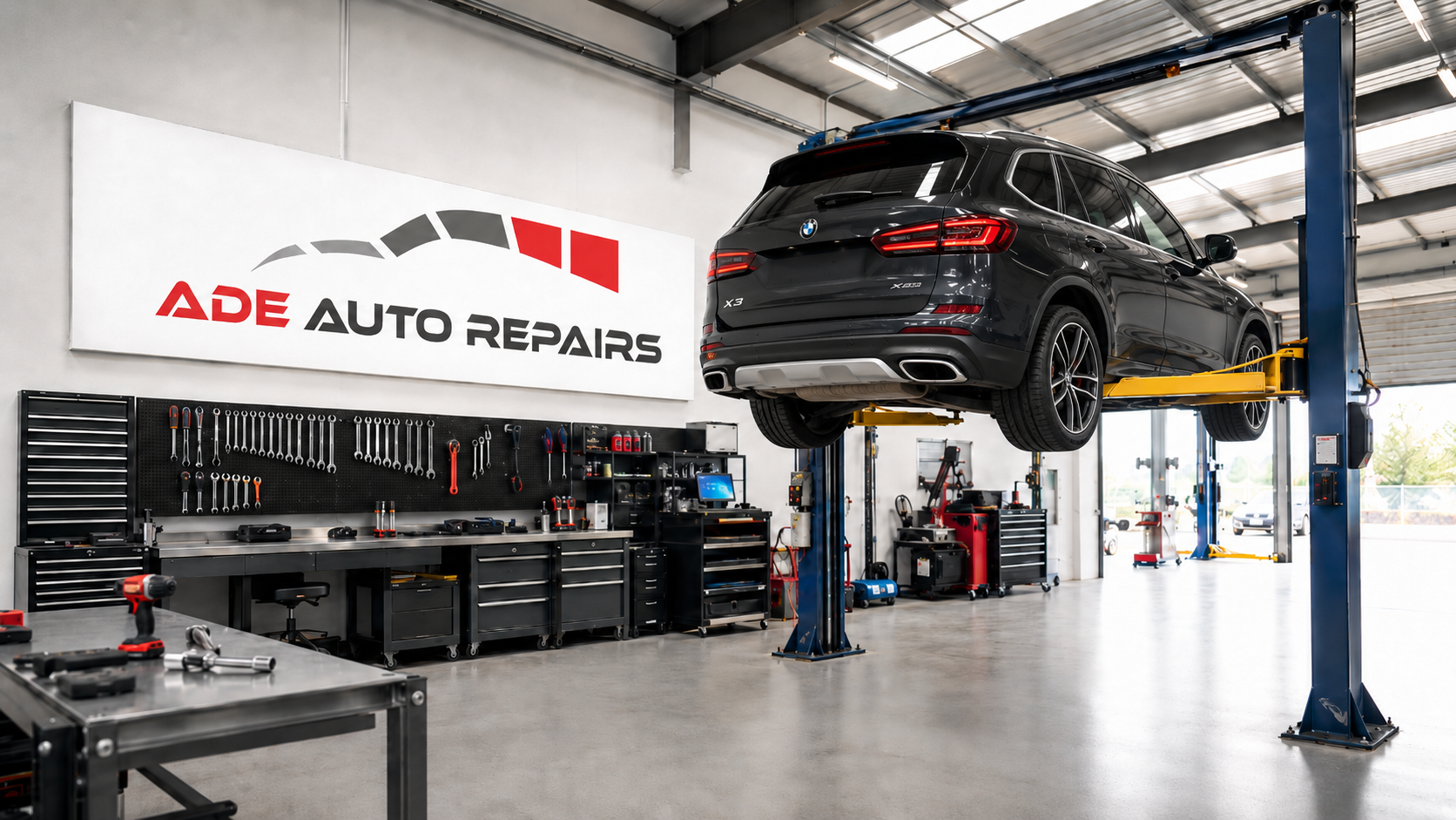 ADE Auto Repairs garage entrance under a brick railway arch