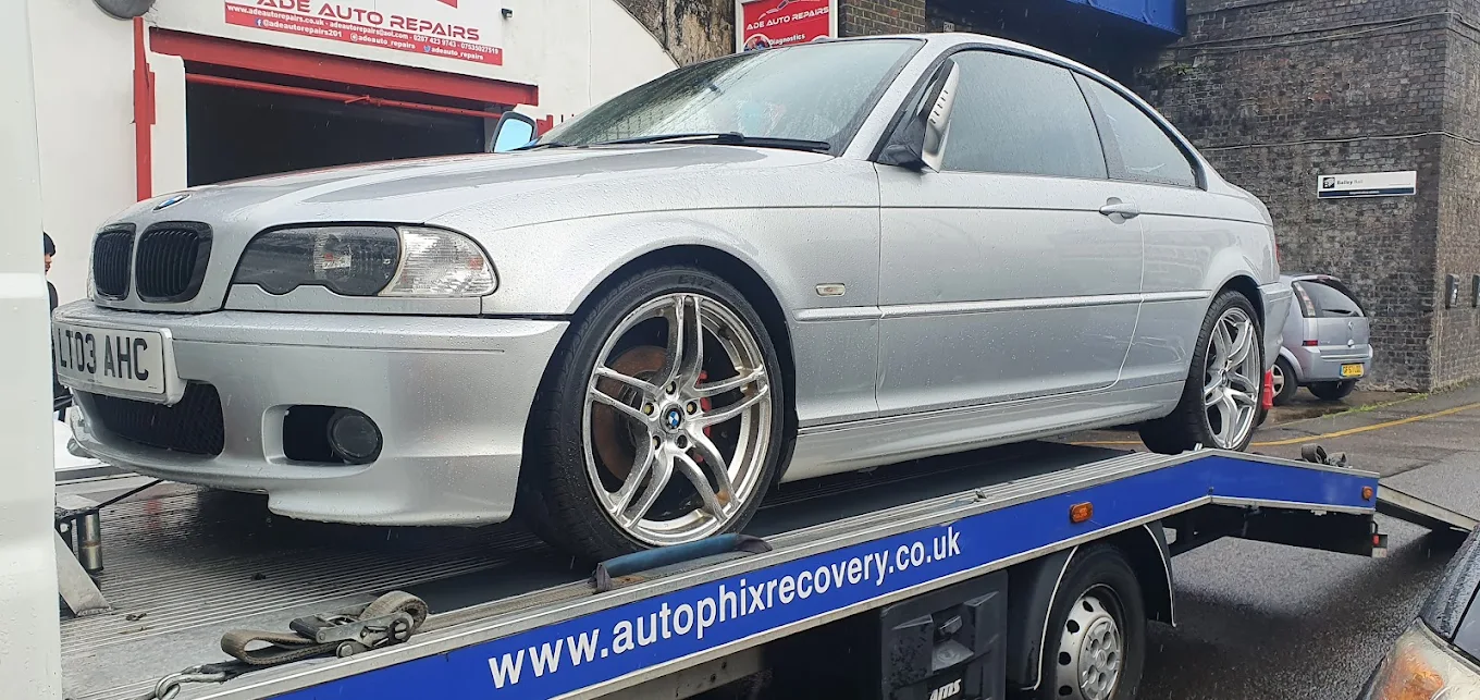 Customer's BMW arriving at the ADE Auto Repairs workshop on a recovery truck